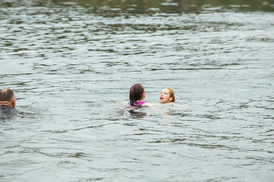 Two people swimming in water