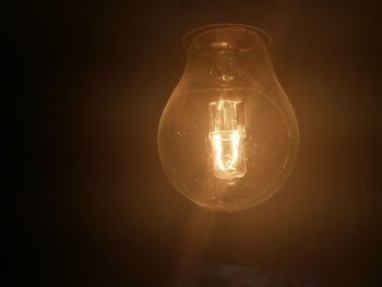 Close-up of illuminated light bulb