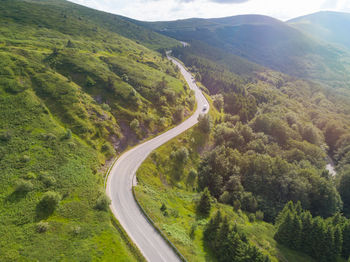 High angle view of road amidst mountains