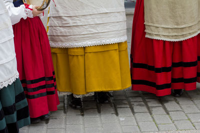 Low section of people wearing traditional clothing