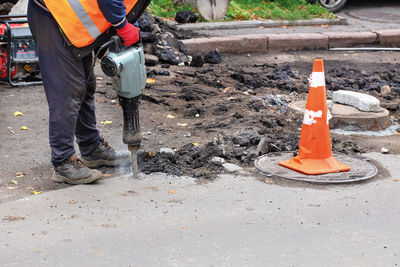 Low section of men working on construction site