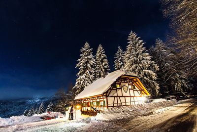 Snow covered landscape at night