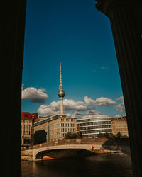 Buildings against cloudy sky