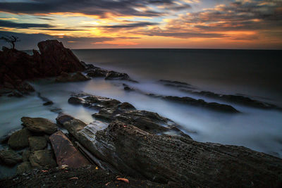 Scenic view of sea against sky during sunset