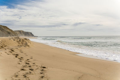Scenic view of beach against sky