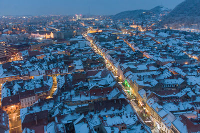 High angle view of illuminated city buildings at night