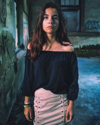 Portrait of beautiful young woman standing outdoors