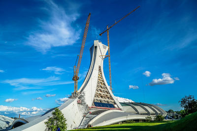 Low angle view of structure against blue sky