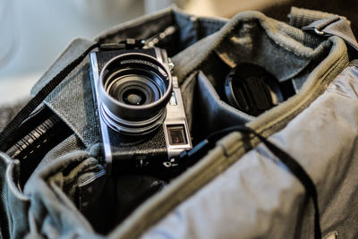 High angle view of camera in bag