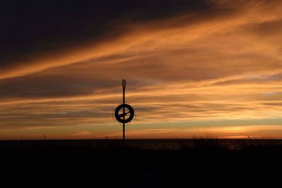 Silhouette landscape against sky during sunset