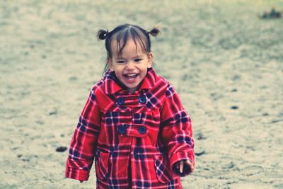 Cheerful girl on land