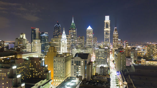 Illuminated buildings in city at night