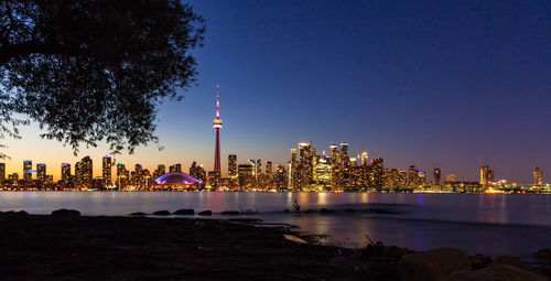 Illuminated city buildings at night