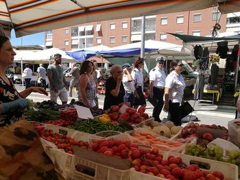 People at market stall