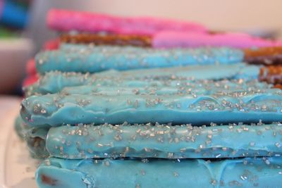 Close-up of pretzel sticks with frosting