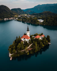 High angle view of sea and mountains against sky