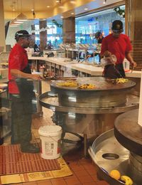 People working at market stall