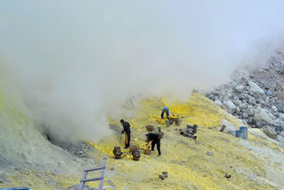 High angle view of people working on mountain