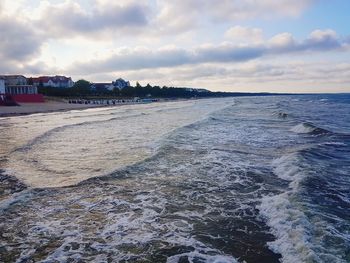 Scenic view of beach against sky during sunset