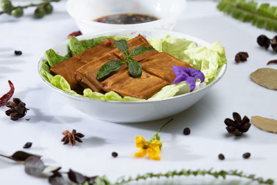 High angle view of fruits in plate on table