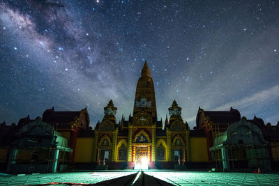 Panoramic view of historic building against sky at night