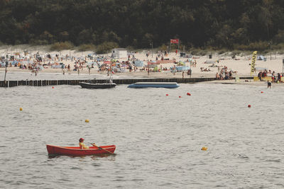 People enjoying on beach