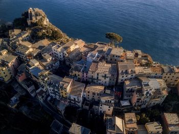 High angle view of townscape by sea