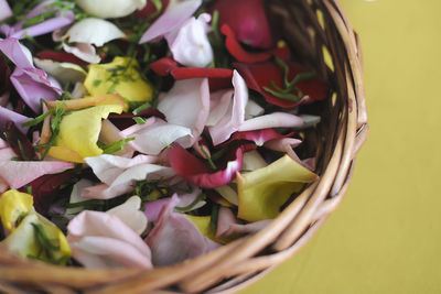 High angle view of pink roses in basket