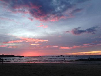 Scenic view of sea against cloudy sky