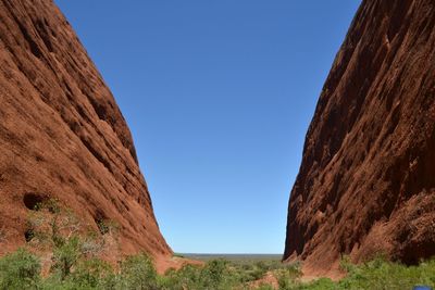 Scenic view of rocky mountains against clear blue sky