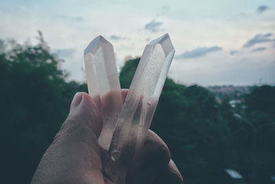 Close-up of hand holding crystals