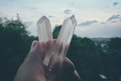 Close-up of hand holding crystals