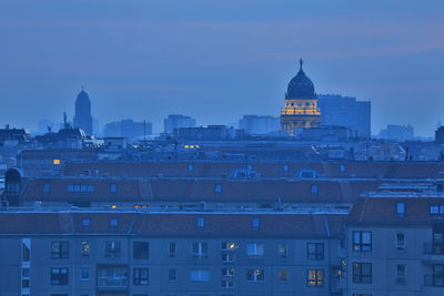 View of buildings in city at dusk