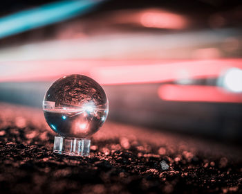 Close-up of illuminated ball with reflection