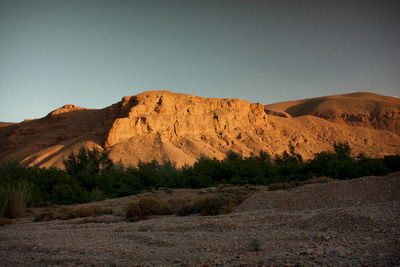 Scenic view of desert against clear sky