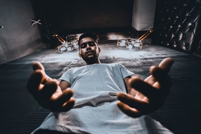 Portrait of young man sitting at home