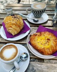 Fresh sweets brioche, cappuccino, breakfast products, dessert on the table, cream cake