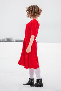 Woman standing on snow
