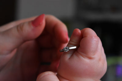 Close-up of woman holding hands