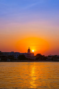 View of buildings against sky during sunset