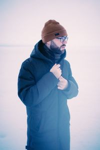 Full length of man standing against snow