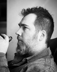 Close-up of young man smoking cigarette