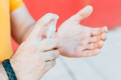 Close-up of man holding hands