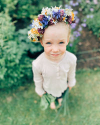 Portrait of cute girl with pink flower