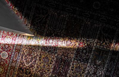 Low angle view of multi colored roof at night