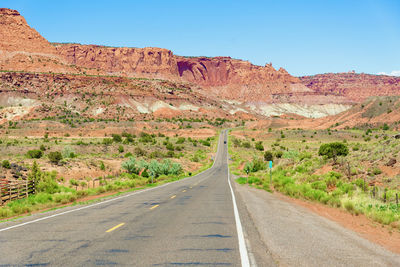 Road amidst landscape against sky