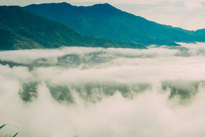 View of mountain range against cloudy sky