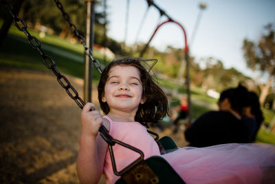 Portrait of happy girl smiling outdoors