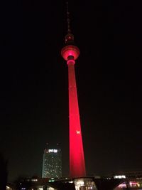 Low angle view of tower at night