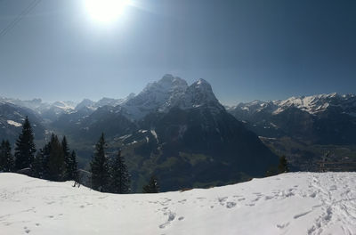 Scenic view of snow mountains against sky